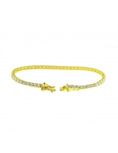 Yellow gold plated tennis bracelet with 3 mm white zircons. in 925 silver