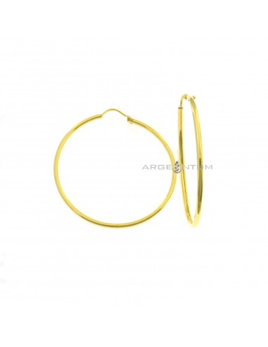 Tubular circle earrings ø 50 mm with yellow gold plated bridge clasp in 925 silver