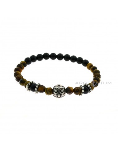 Elastic bracelet with black onyx spheres and tiger eye spheres faceted with 4 dotted washers and central owl in 925 burnished silver