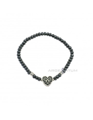 Elastic bracelet with faceted hematite washers and lateral silver nuggets and central heart in 925 burnished silver