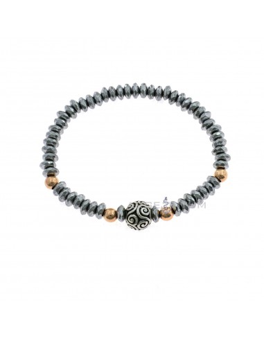 Elastic bracelet with faceted silver galvanized hematite washers and rose gold plated spheres and central sphere engraved in 925 burnished silver