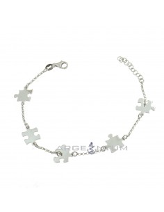 Rolled mesh bracelet with white gold plated puzzle pieces in 925 silver
