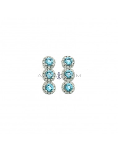 Lobe earrings with blue zircons in white gold plated white zircon frames in 925 silver