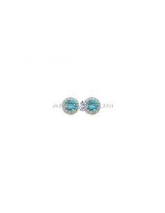Lobe earrings ø 6 mm with central round blue zircon in a frame of white zircons plated white gold in 925 silver