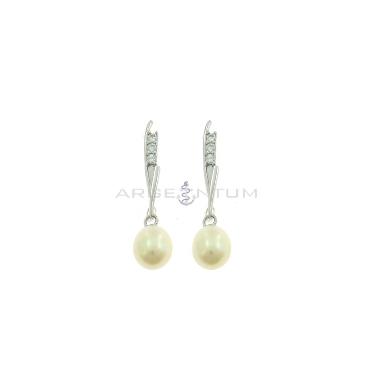 Pendant earrings with rigid wand attachment with 3 white zircons and oval pearl plated white gold in 925 silver
