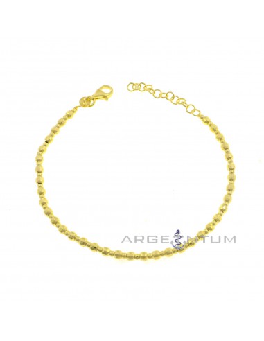 Bracelet with shiny spheres alternating with faceted spheres yellow gold plated in 925 silver