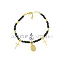 Black swarovski mesh bracelet alternating with shiny spheres with plate crosses and miraculous medal pendants yellow gold plated