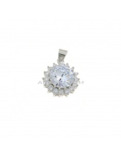 White round zircon pendant ø 12 mm. on a white gold plated base with a white zircon jaws frame in 925 silver