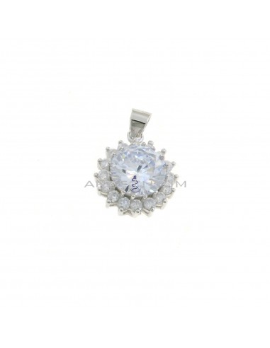 White round zircon pendant ø 12 mm. on a white gold plated base with a white zircon jaws frame in 925 silver