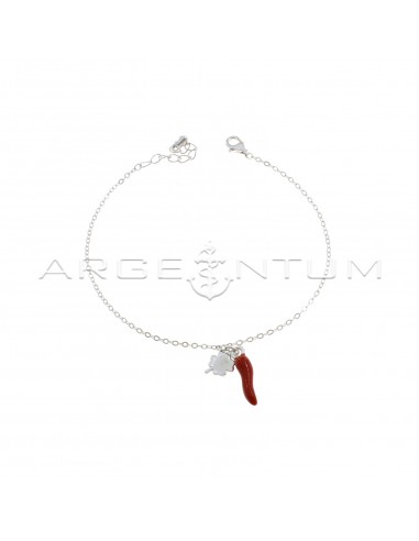 Forced mesh bracelet with central four-leaf clover pendants and white gold-plated red enameled horn in 925 silver