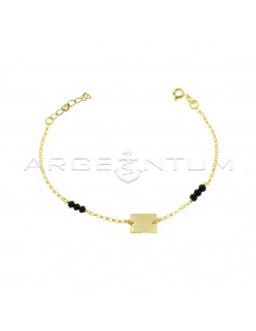 Rolo mesh bracelet with central rectangular plate and black lateral swarovski, yellow gold plated in 925 silver
