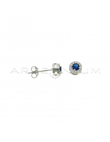 Lobe earrings ø 6 mm with central round blue zircon in a frame of white zircons plated white gold in 925 silver