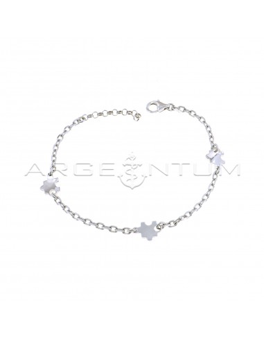Forced mesh bracelet with white gold plated puzzle pieces in 925 silver