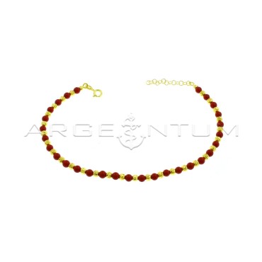 Anklet with diamond spheres and yellow gold plated coral paste spheres in 925 silver