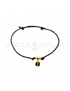 Black cord bracelet with slip knots, hammered nuggets and paired and enamelled ladybug pendant, yellow gold plated 925 silver