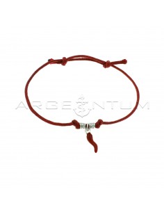 Red cord bracelet with slip knots, hammered nuggets and white gold plated red enamel pendant horn in 925 silver