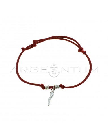 Red cord bracelet with slip knots, hammered nuggets and white gold plated horn pendant in 925 silver