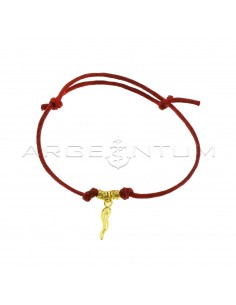 Red cord bracelet with slip knots, hammered nuggets and yellow gold plated horn pendant in 925 silver