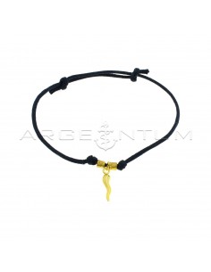 Dark blue cord bracelet with slip knots, hammered nuggets and yellow gold plated horn pendant in 925 silver