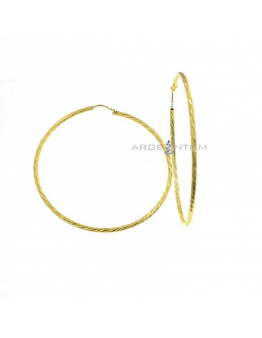 Orecchini cerchio diamantato trasversale ø 65 mm. placcati oro giallo in argento 925