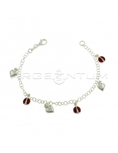 Giotto mesh bracelet with pendants coupled with enameled ladybugs alternating with smooth hearts in 925 silver