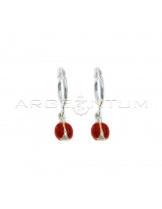Tubular hoop earrings with bridge closure and enamelled ladybug pendant coupled in 925 silver