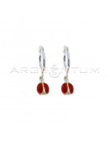 Tubular hoop earrings with bridge closure and enamelled ladybug pendant coupled in 925 silver