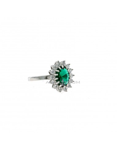 White gold plated ring with green oval stone 6x8 mm in a frame of white zirconia claws in 925 silver (Size 17)