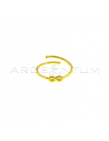 Adjustable wire ring with central striped infinity in yellow gold plated 925 silver