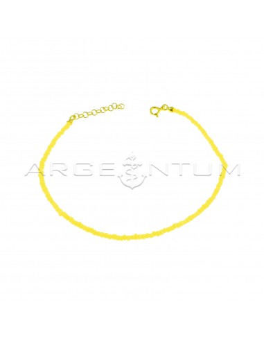 Yellow resin tube anklet with yellow gold plated terminals, closure and extension in 925 silver