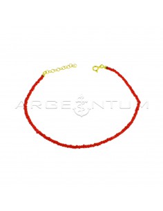 Red resin tube anklet with yellow gold plated terminals, closure and extension in 925 silver