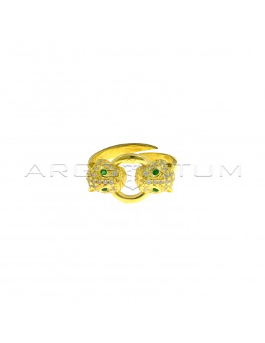 Adjustable ring with white zircon panther heads with green zircon eyes and central round shape yellow gold plated 925 silver