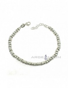 White gold plated bracelet with alternating smooth and striped washers in 925 silver