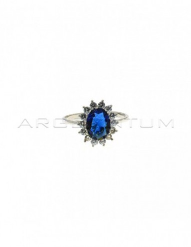 White gold plated ring with blue oval stone 6x8 mm in a frame of white zircons with claws in 925 silver (Size 18)