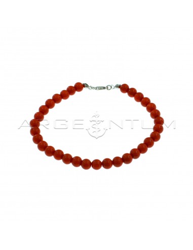 Ball bracelet in coral paste ø 6 mm with white gold plated terminals and snap hook in 925 silver
