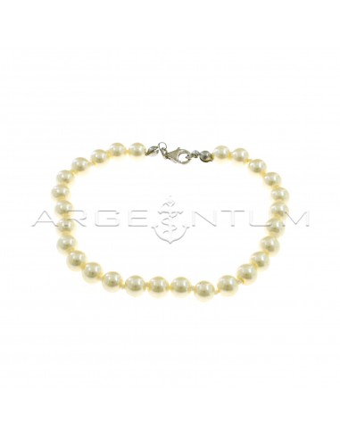 Bracciale di perle da ø 6 mm infilate a nodini con terminali e moschettone placcati oro bianco in argento 925