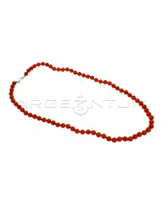 Ball necklace in coral paste ø 6 mm threaded into knots with white gold plated terminals and snap hook in 925 silver (Length 45 cm)