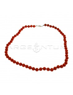 Ball necklace in coral paste ø 6 mm threaded in knots with white gold plated terminals and snap hook in 925 silver (Length 40 cm)