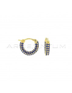 Blue zircon tubular hoop earrings with yellow gold plated bridge clasp in 925 silver