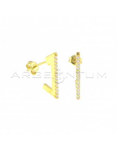 White semizirconated triangular lobe earrings with yellow gold plated snap attachment in 925 silver