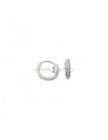 Orecchini a cerchio da ø 12 mm semizirconato bianco a binario con chiusura a scattino placcati oro bianco in argento 925