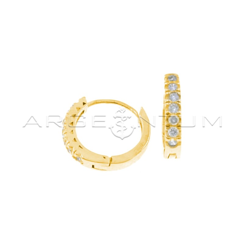 Hoop earrings with white zircons with yellow gold plated snap closure in 925 silver