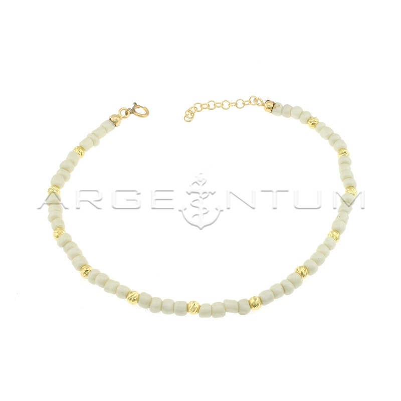 Cavigliera con tubetti in resina bianca e sfere diamantate placcata oro giallo in argento 925