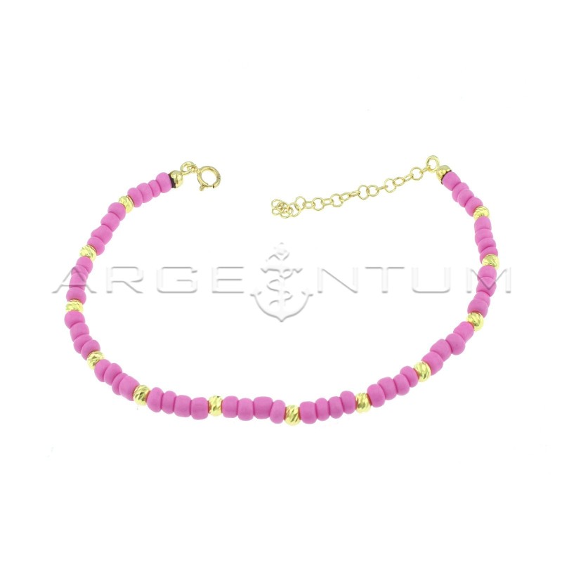 Anklet with fuchsia resin tubes and yellow gold plated diamond spheres in 925 silver