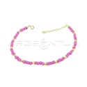 Anklet with fuchsia resin tubes and yellow gold plated diamond spheres in 925 silver