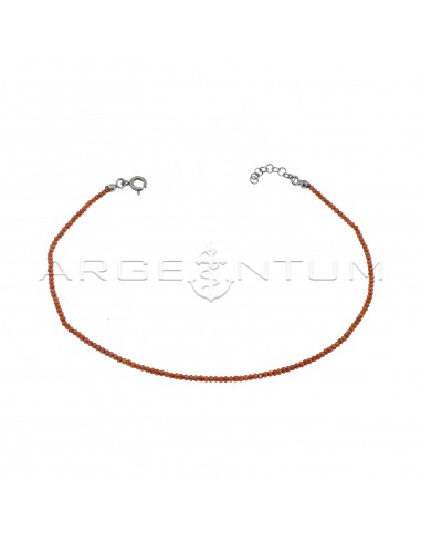 Anklet of red faceted zircons, white...