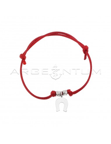 Red cord bracelet with slip knots,...
