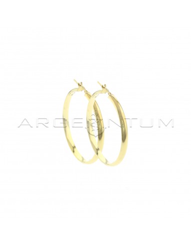 Rounded band hoop earrings with...