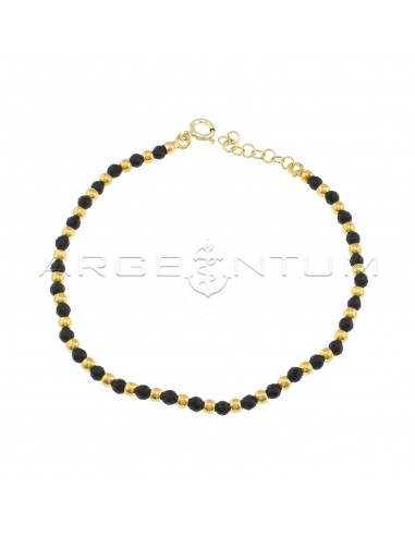 Ball bracelet and black faceted...