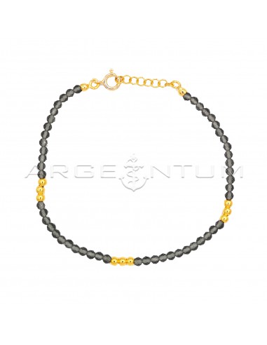 Bracelet of gray crystals and yellow...